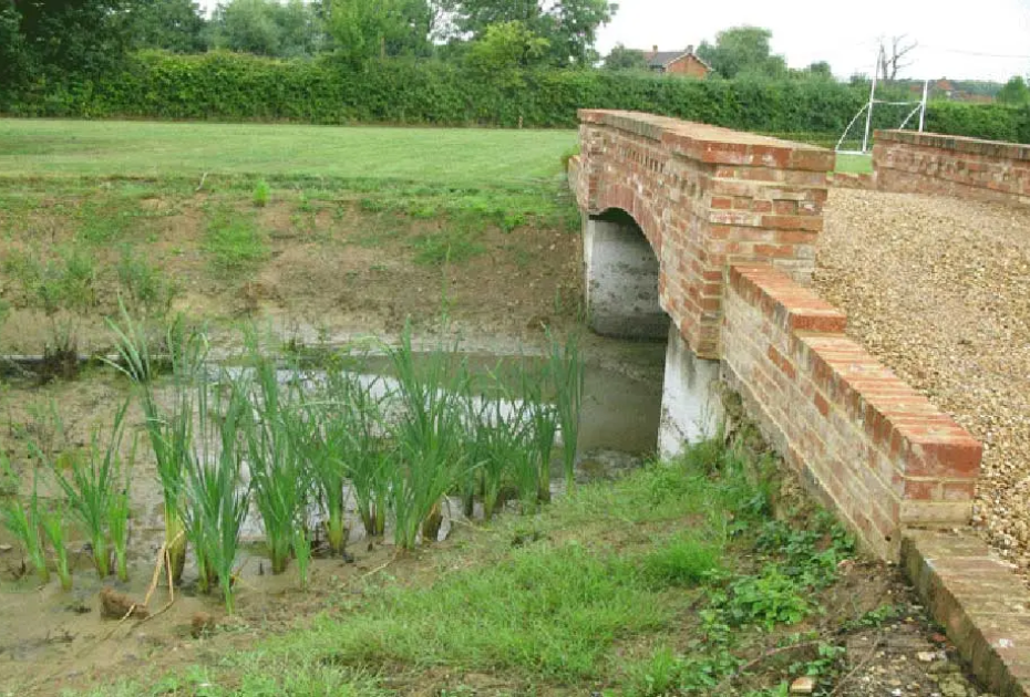  Pond includes a section which runs under a single track road bridge