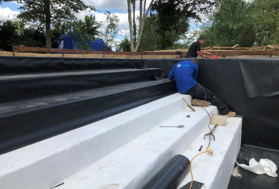 Lining a large swimming pool build in West Sussex
