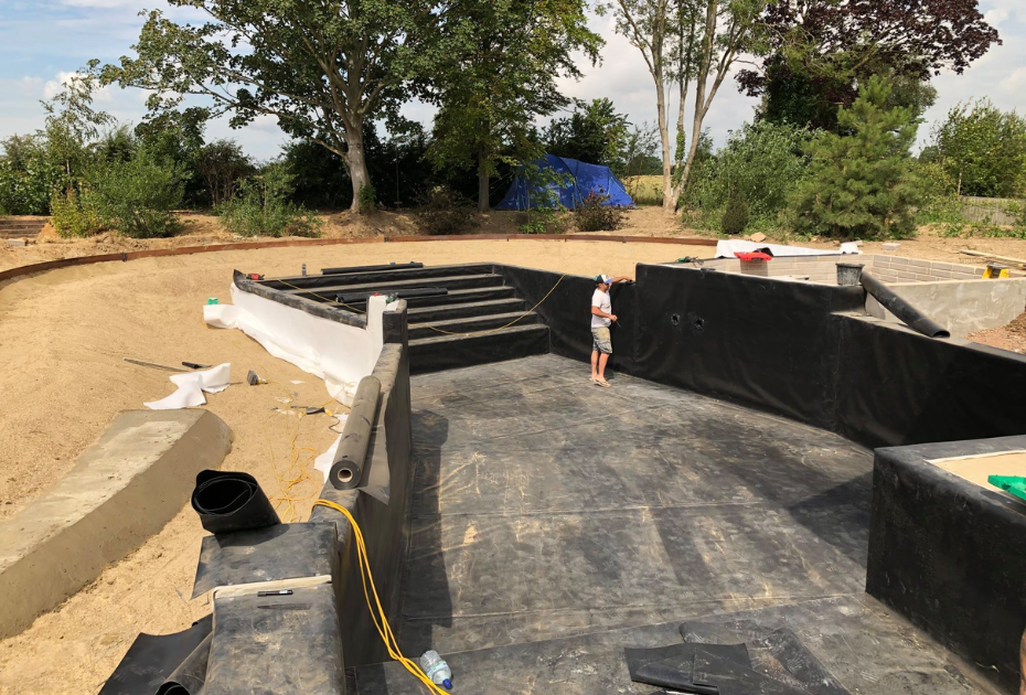 Lining a large swimming pool build in West Sussex
